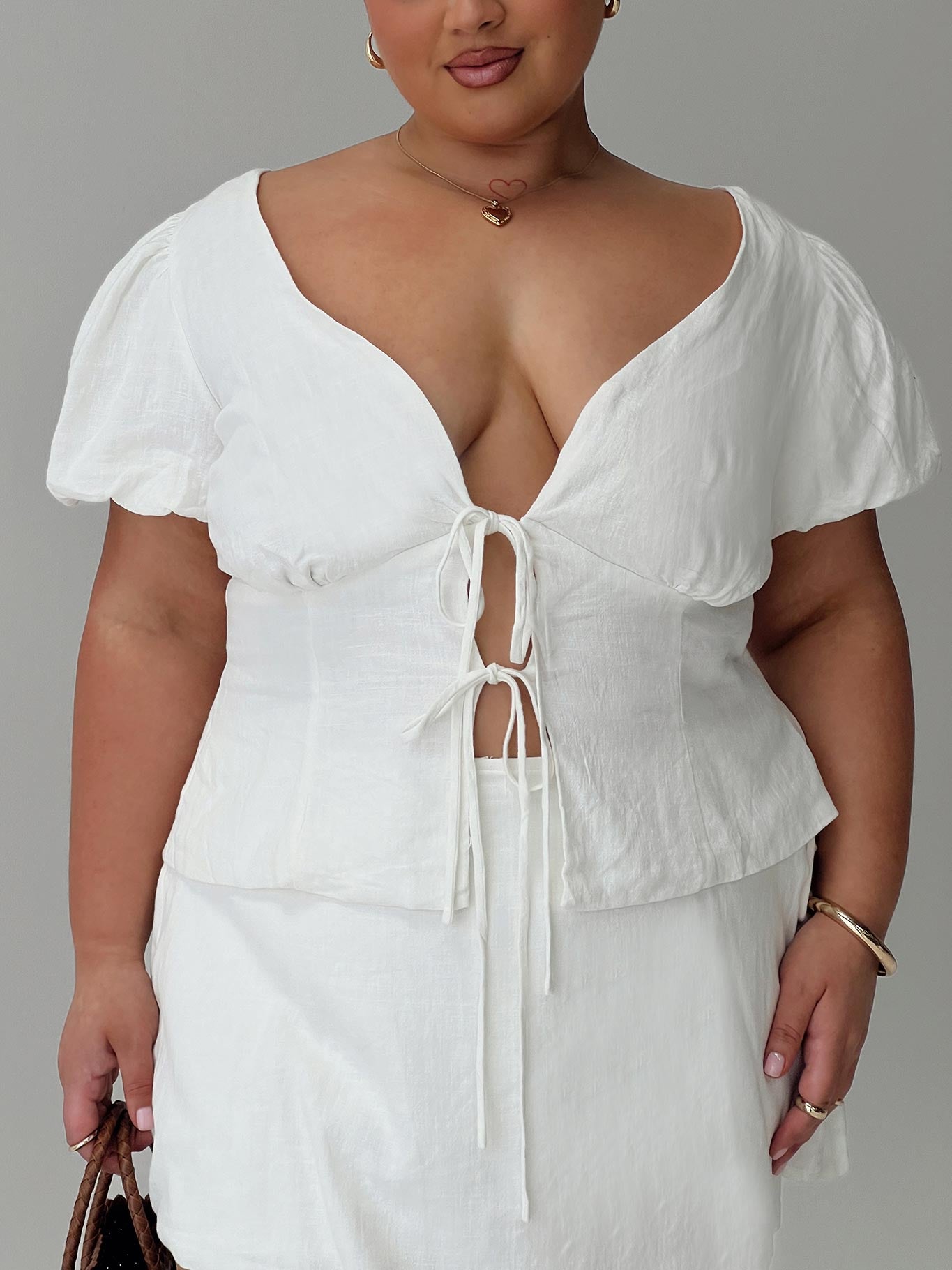 front view of model wearing Princess Polly Wilhelmina Blouse Top White Curve Short Sleeves Plunger 