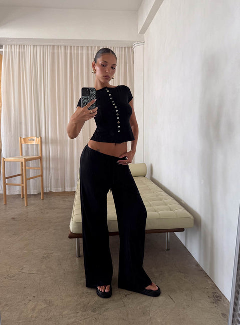 side view of model wearing Princess Polly Gavrielle Jersey Wide Leg Pants Black High Rise Pants 