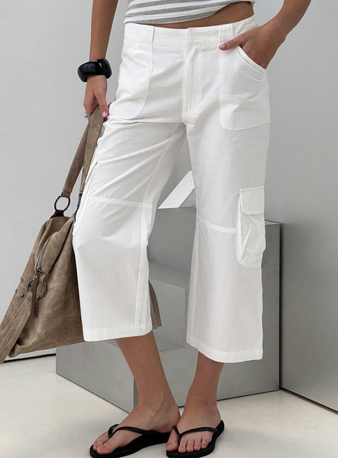 Showcasing the Indee Cropped Cargo Pants White womens-regular-pants with high-rise side view of model wearing Princess Polly