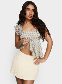   side view of model wearing Princess Polly Another Day Knit Pleat Mini Skirt Butter Yellow Mini Skirts 