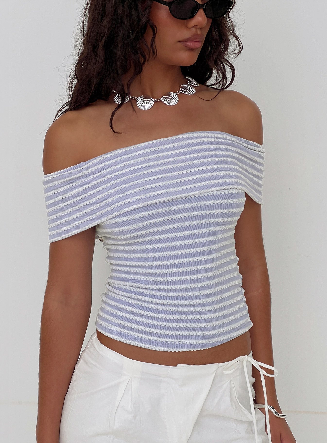 side view of model wearing Princess Polly Ausha Off Shoulder Top Lilac Stripe Short Sleeves straight 