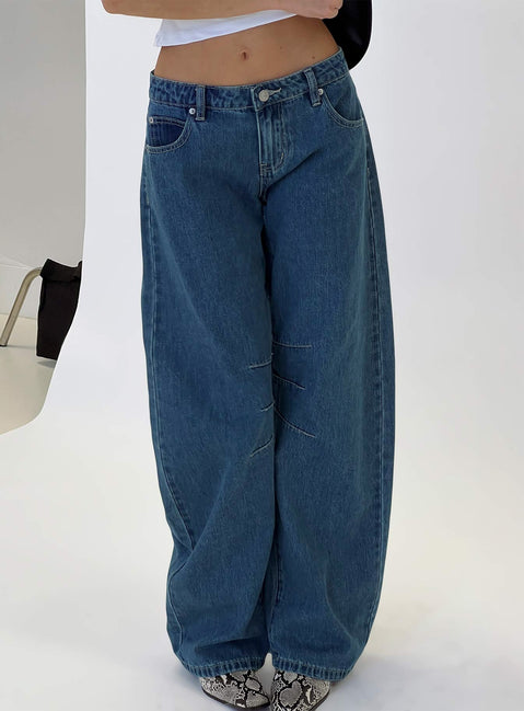 back view of model wearing Princess Polly Lost Track Mid Rise Barrel Leg Jeans Mid Wash Mid Rise Jeans 