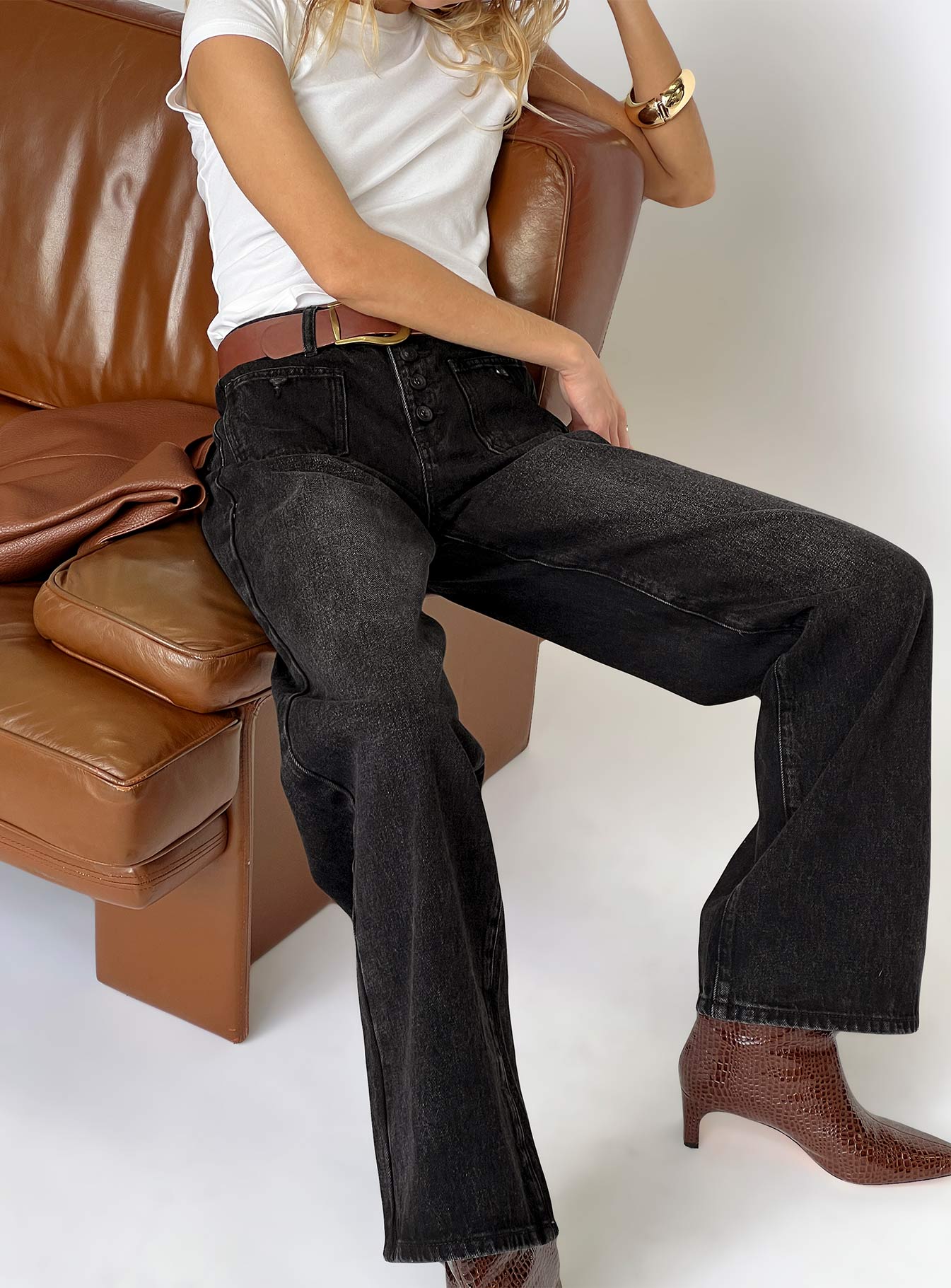 front view of model wearing Princess Polly Carianne Low Rise Wide Leg Jeans Washed Black Mid Rise Jeans 