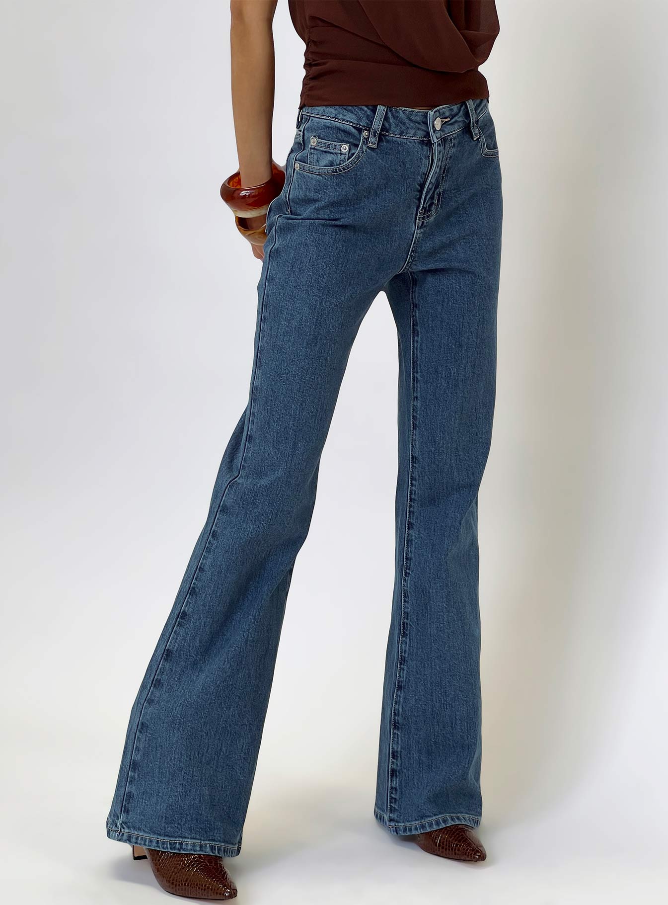 back view of model wearing Princess Polly Magic Mirror Mid Rise Bootleg Jeans Mid Blue Wash Mid Rise Jeans 