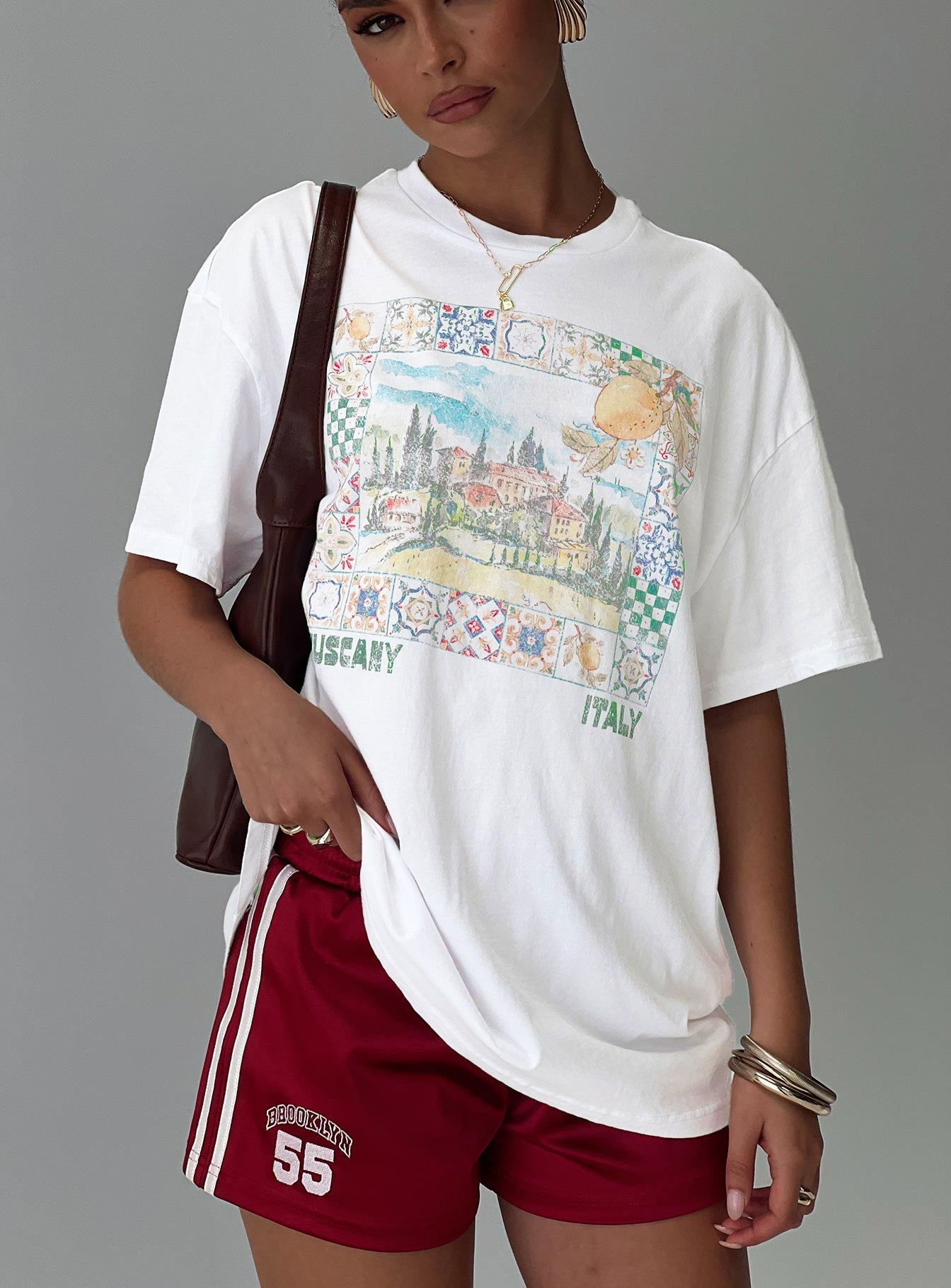 front view of model wearing Princess Polly Love From Tuscany Oversized Graphic Top White Half Sleeves Crew Neck 