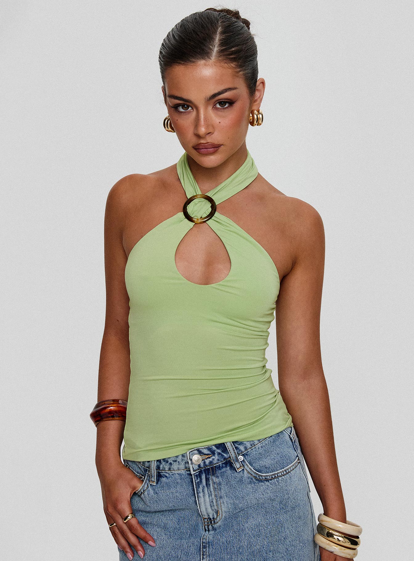 front view of model wearing Princess Polly Quell Top Green Sleeveless High Neck 