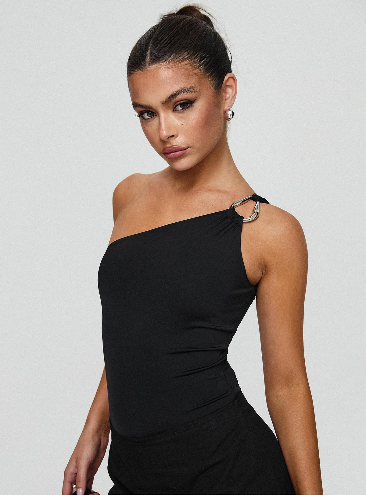 side view of model wearing Princess Polly Talija One Shoulder Bodysuit Black Tall Sleeveless Bodysuit 