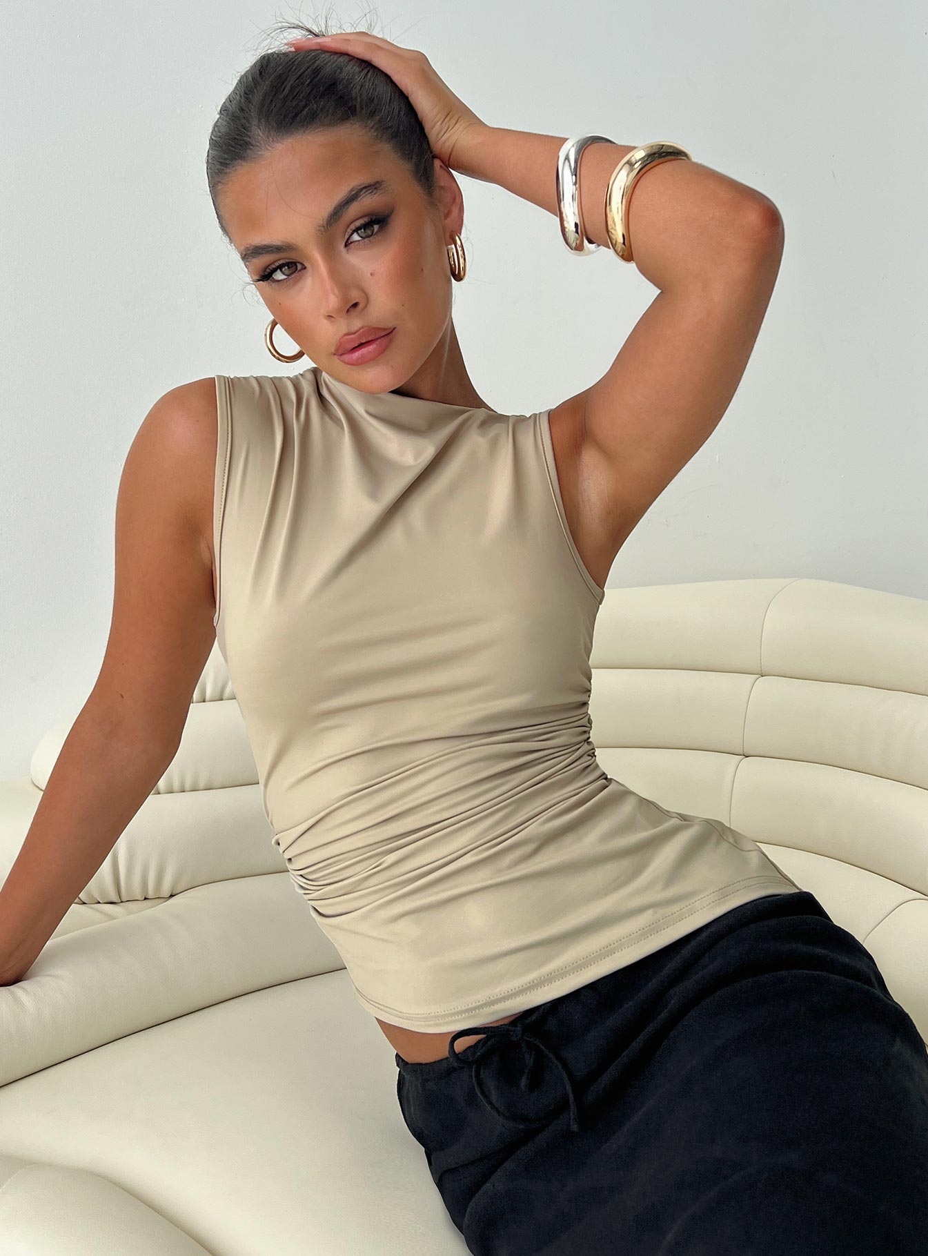 front view of model wearing Princess Polly Jassie Top Beige Sleeveless Asymmetric Neckline 
