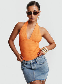 front view of model wearing Princess Polly Emaline Halter Top Orange Sleeveless Plunger 