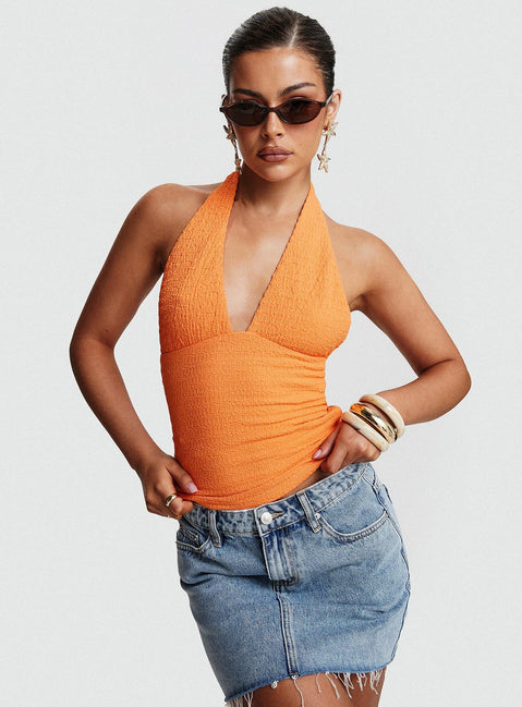 front view of model wearing Princess Polly Emaline Halter Top Orange Sleeveless Plunger 