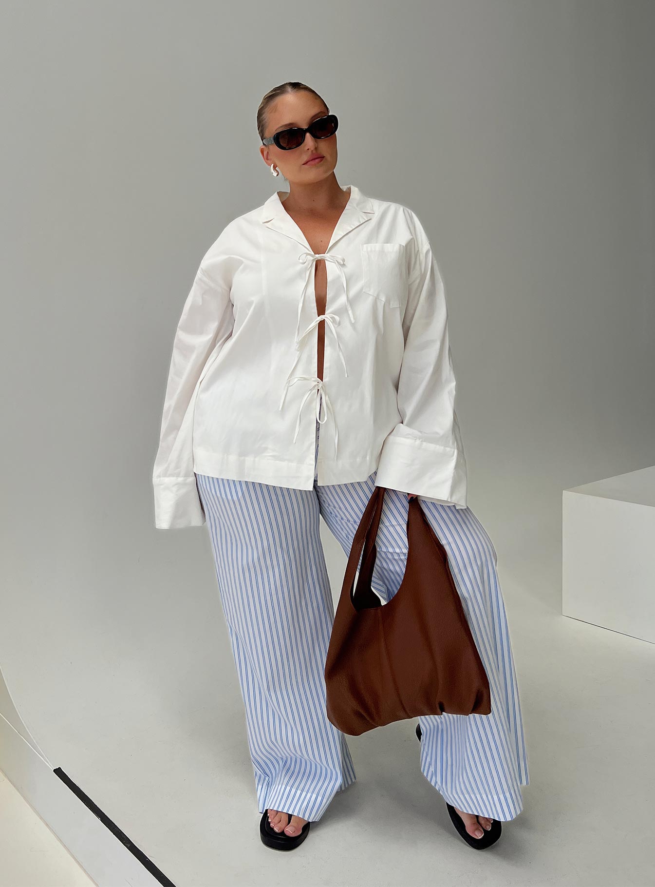 side view of model wearing Princess Polly Spiri Shirt White Curve Full Sleeves V-Neck 