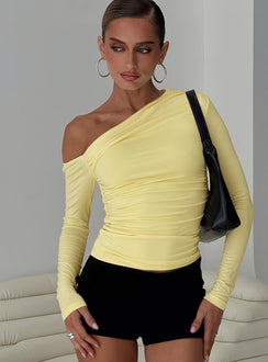 front view of model wearing Princess Polly Beller Long Sleeve Top Lemon Full Sleeves Asymmetric Neckline 