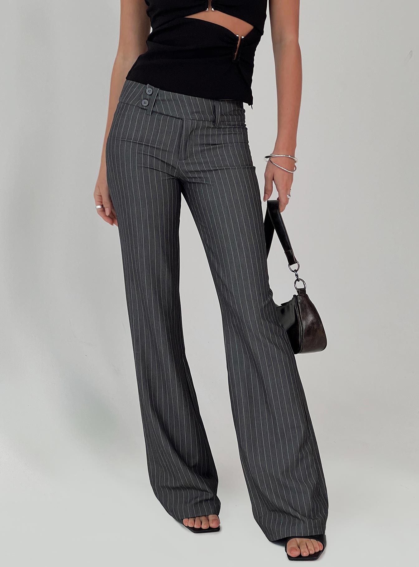 back view of model wearing Princess Polly Kinkirk Flared Pants Grey Pinstripe Tall Low Rise Pants 