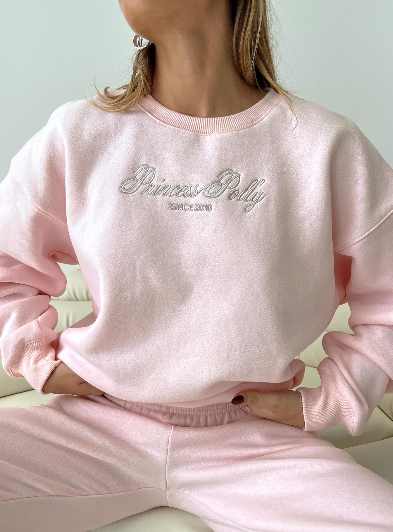 front view of model wearing Princess Polly Princess Polly Crew Neck Sweatshirt Script Baby Pink / Grey 