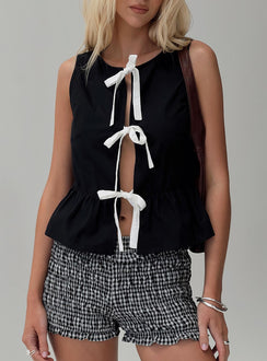 front view of model wearing Princess Polly Ryoti Top Black Sleeveless Crew Neck 