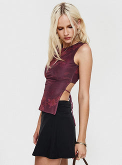 side view of model wearing Princess Polly Uzo Top Red Floral Sleeveless Crew Neck 