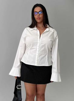 side view of model wearing Princess Polly By The Phone Long Sleeve Collared Top White Curve Full Sleeves V-Neck 