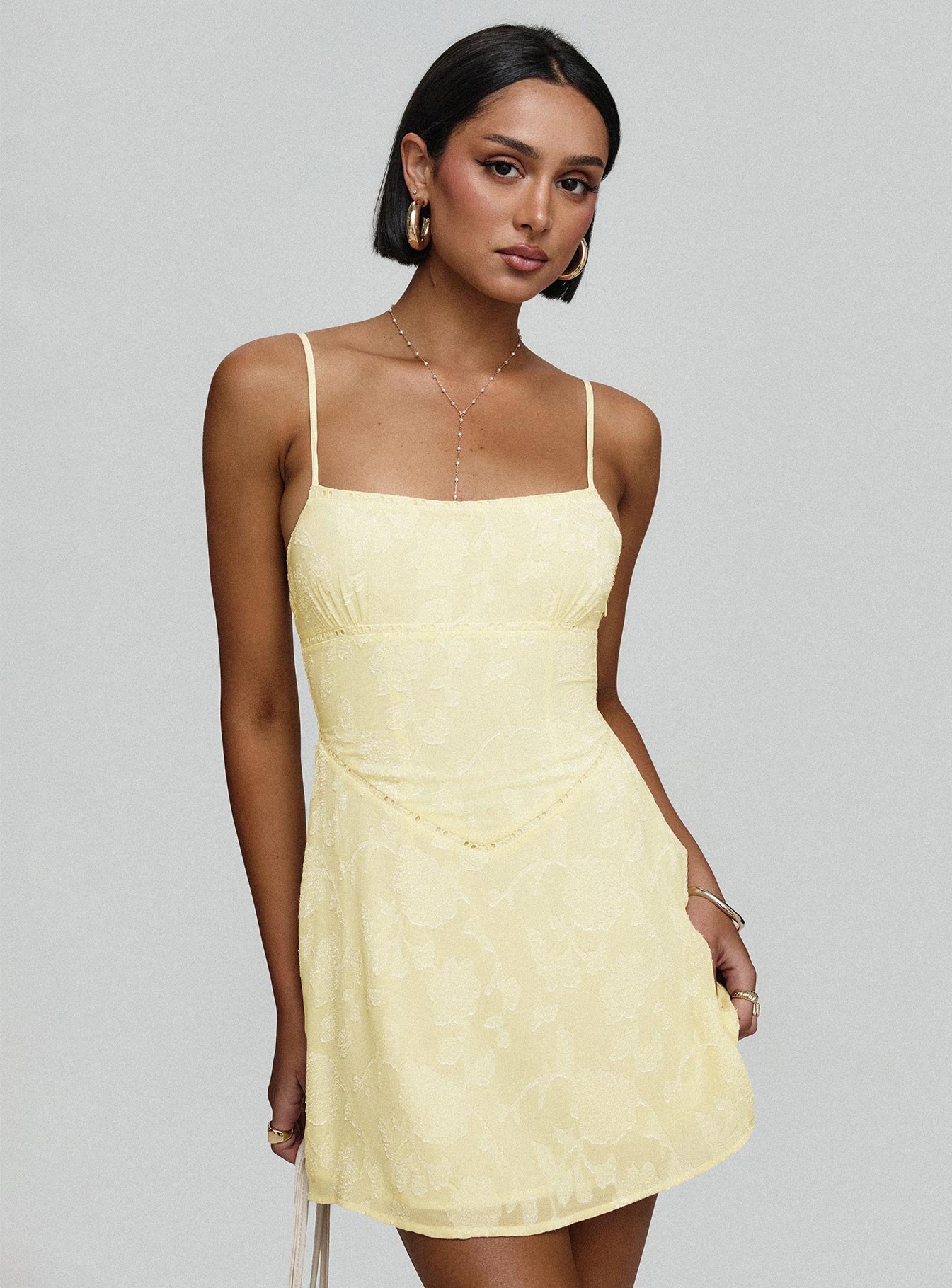 side view of model wearing Princess Polly South Of France Mini Dress Yellow Petite Square Neck 