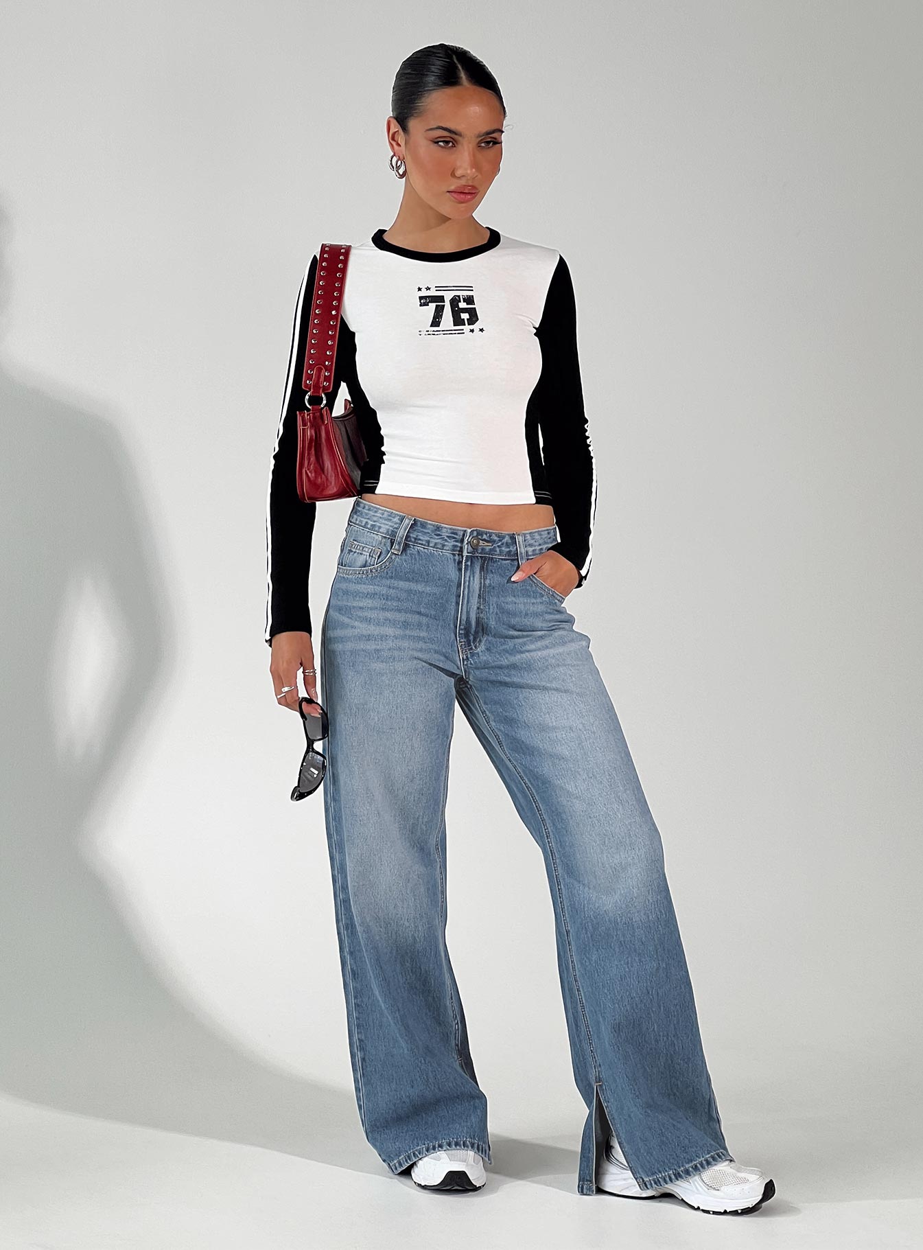 Front view of model wearing  front Princess Polly High Waisted  Azula Mid Rise Wide Leg Denim Jean Mid Blue