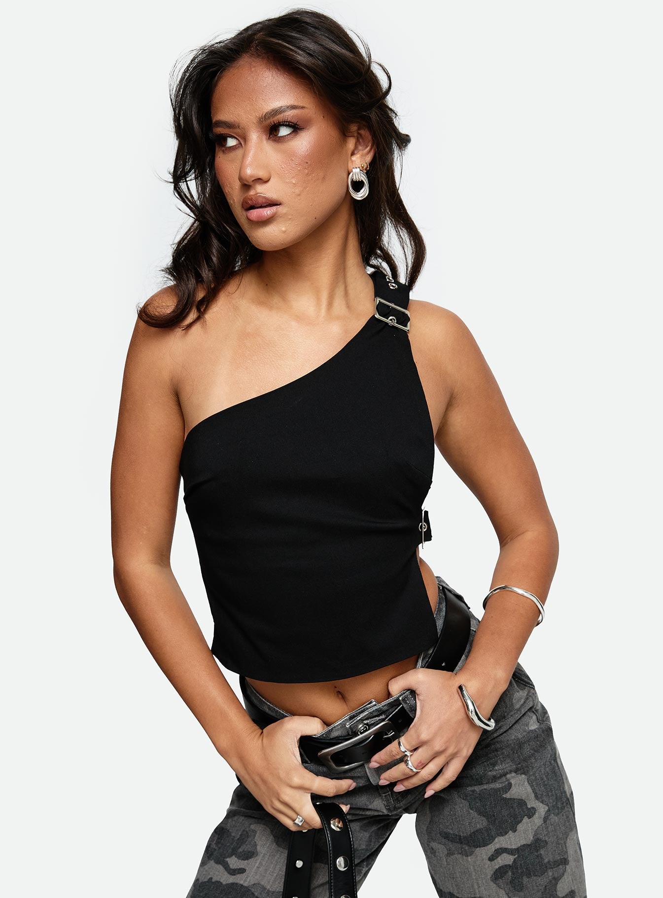 front view of model wearing Princess Polly Buckled Down One Shoulder Top Black Sleeveless Asymmetric Neckline 