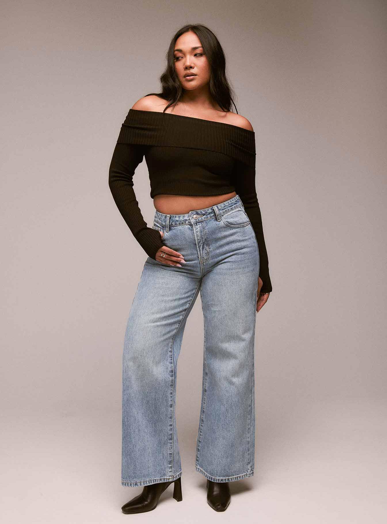 Wide leg jeans mid-wash denim Belt looped waist five pocket design zip and button fastening