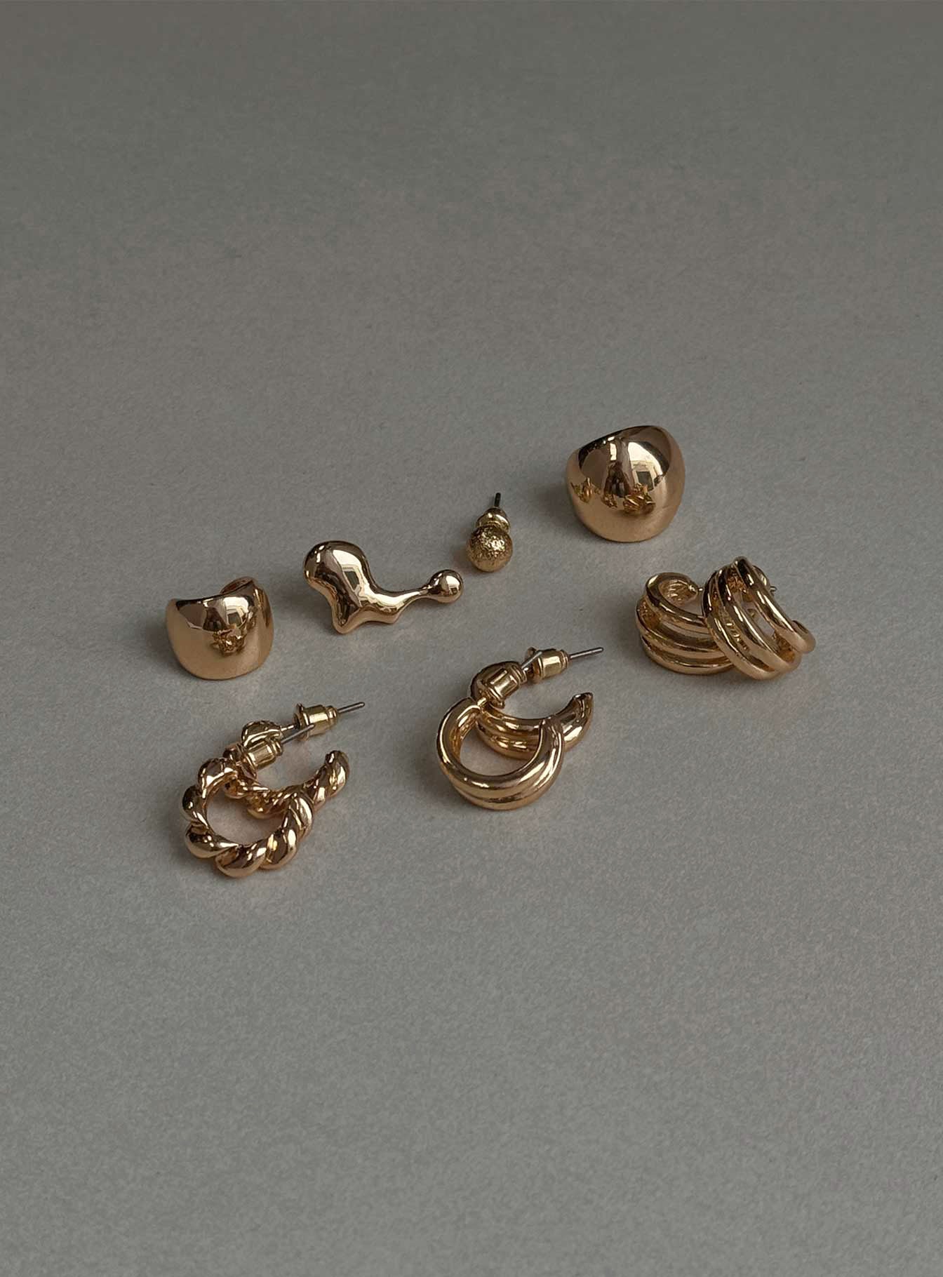 Gold toned earring pack Four pairs & two separate styles, stud fastening