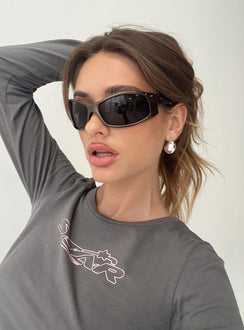 Sunglasses Wrap around style, smoke tinted lens, moulded nose bridge, star detail