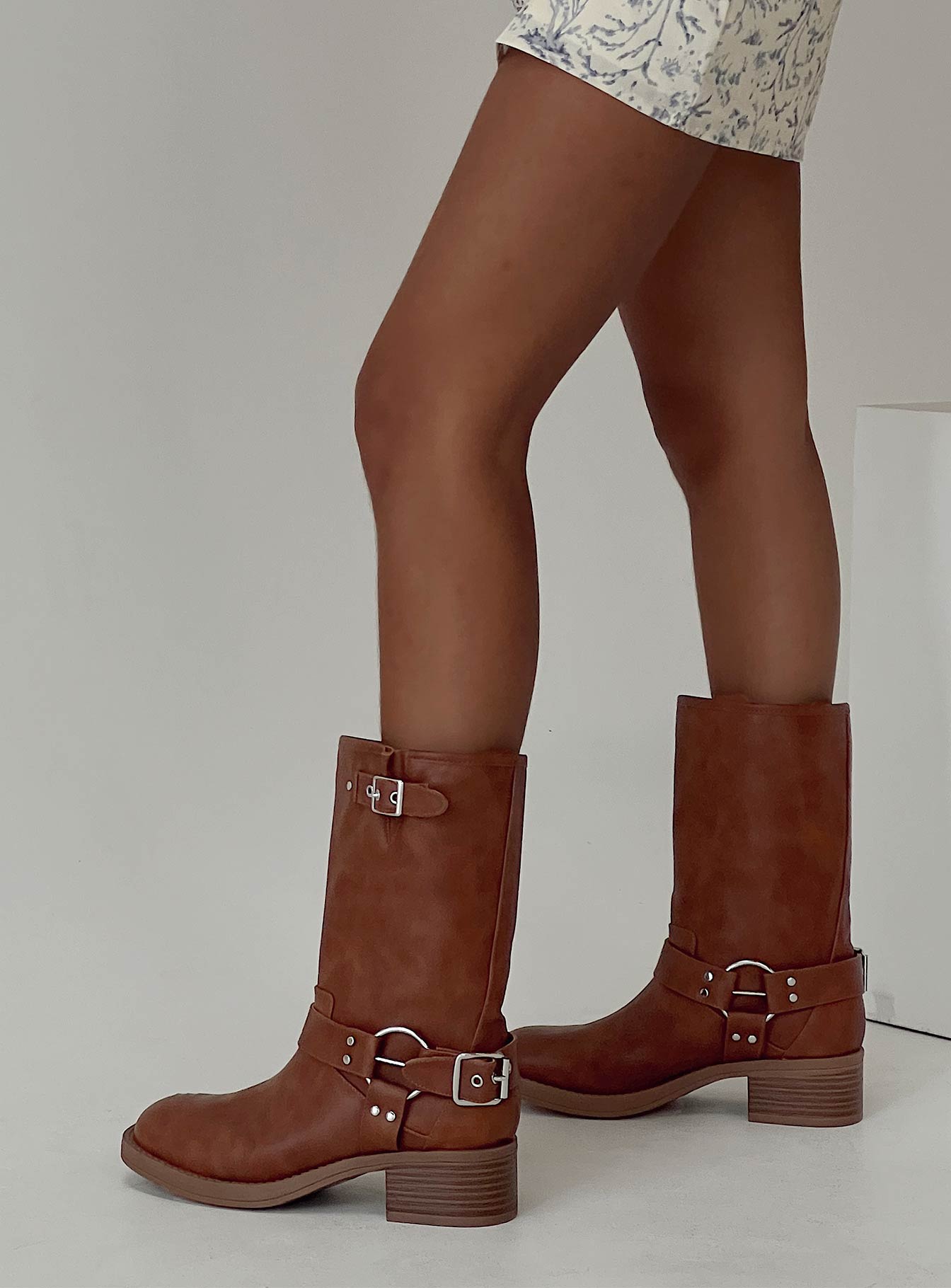 Boots on design, silver-toned buckles, rounded toe, padded footbed