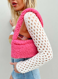 Shoulder bag Faux fur material Fixed strap Magnetic button fastening Internal pockets Flat base