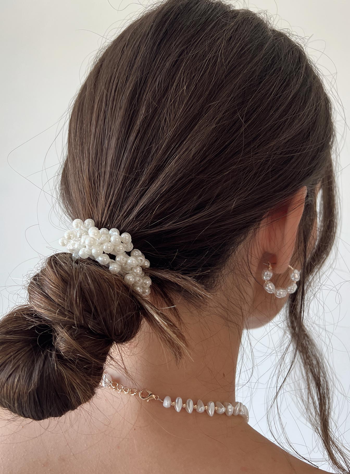 Hair tie  95% plastic 5% elastic string Pearl beads  Elasticated band 