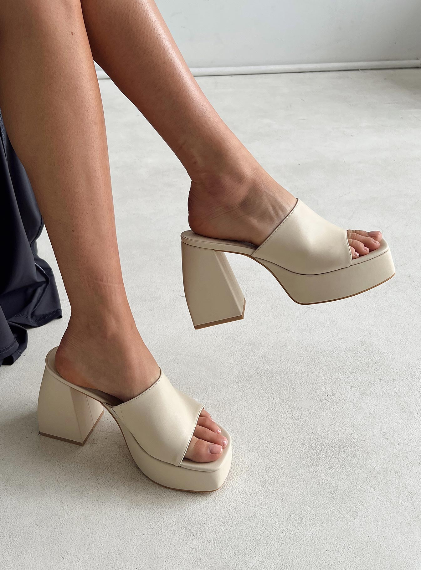 Cream mules Faux leather material Single wide upper Block heel Platform base