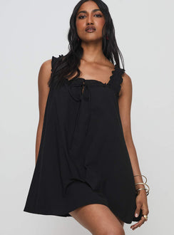 side view of model wearing Princess Polly Swing Mini Dress Black Square Neck 