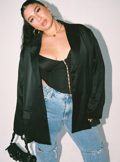 Blazer Satin material Lapel collar Button fastening at front Twin front pockets Slit at back Non-stretch Fully lined