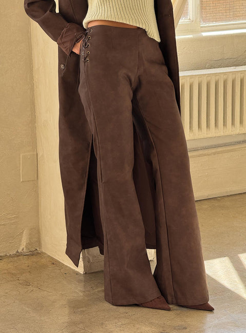 back view of model wearing Princess Polly Trickrider Tie Side Faux Leather Pants Chocolate Mid Rise Pants 
