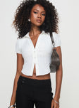 Shirt Classic collar, button fastening, puffed sleeves, ruched bust detail Non-stretch material, unlined 