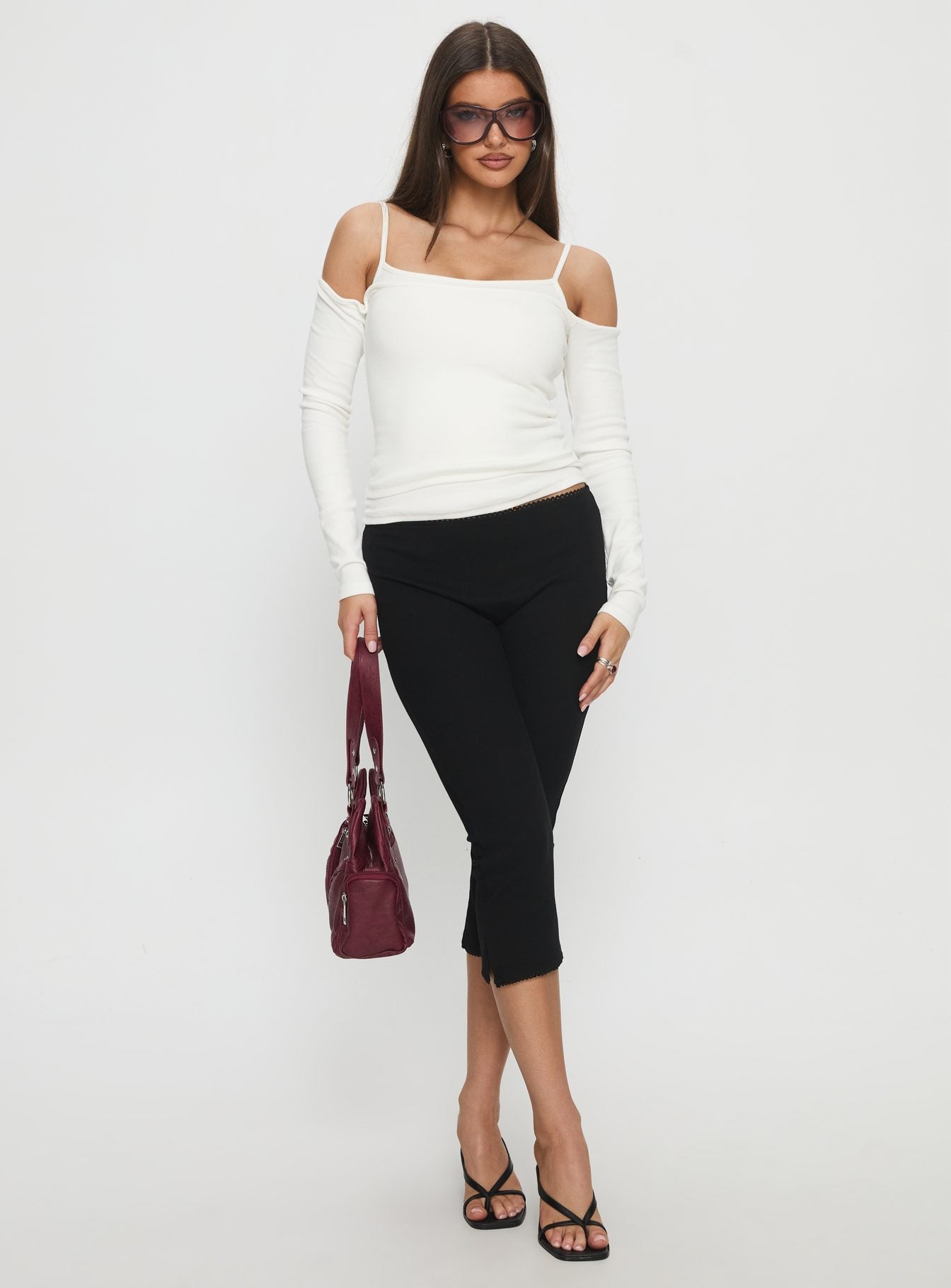 front view of model wearing Princess Polly Baseline Rib Capri Pants Black High Rise Pants 