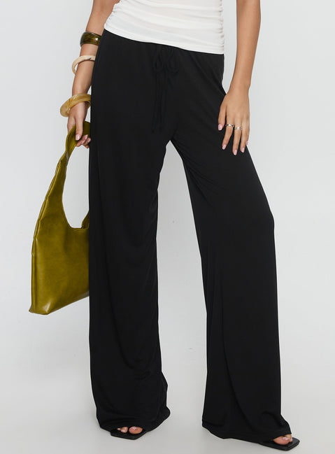 front view of model wearing Princess Polly Gavrielle Jersey Wide Leg Pants Black High Rise Pants 
