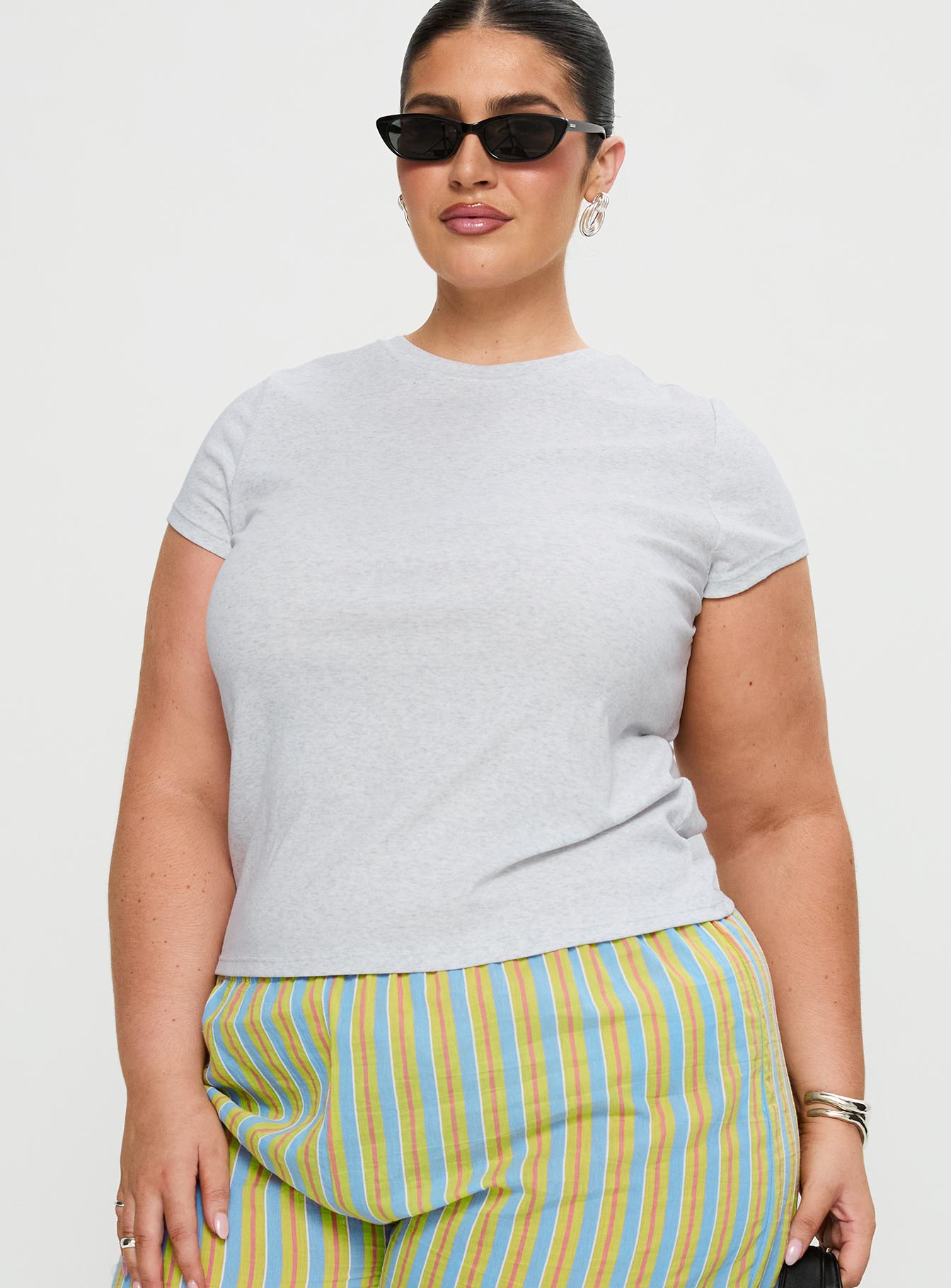 front view of model wearing Princess Polly Prestige Longline Baby Tee Grey Curve Sleeveless Crew Neck 