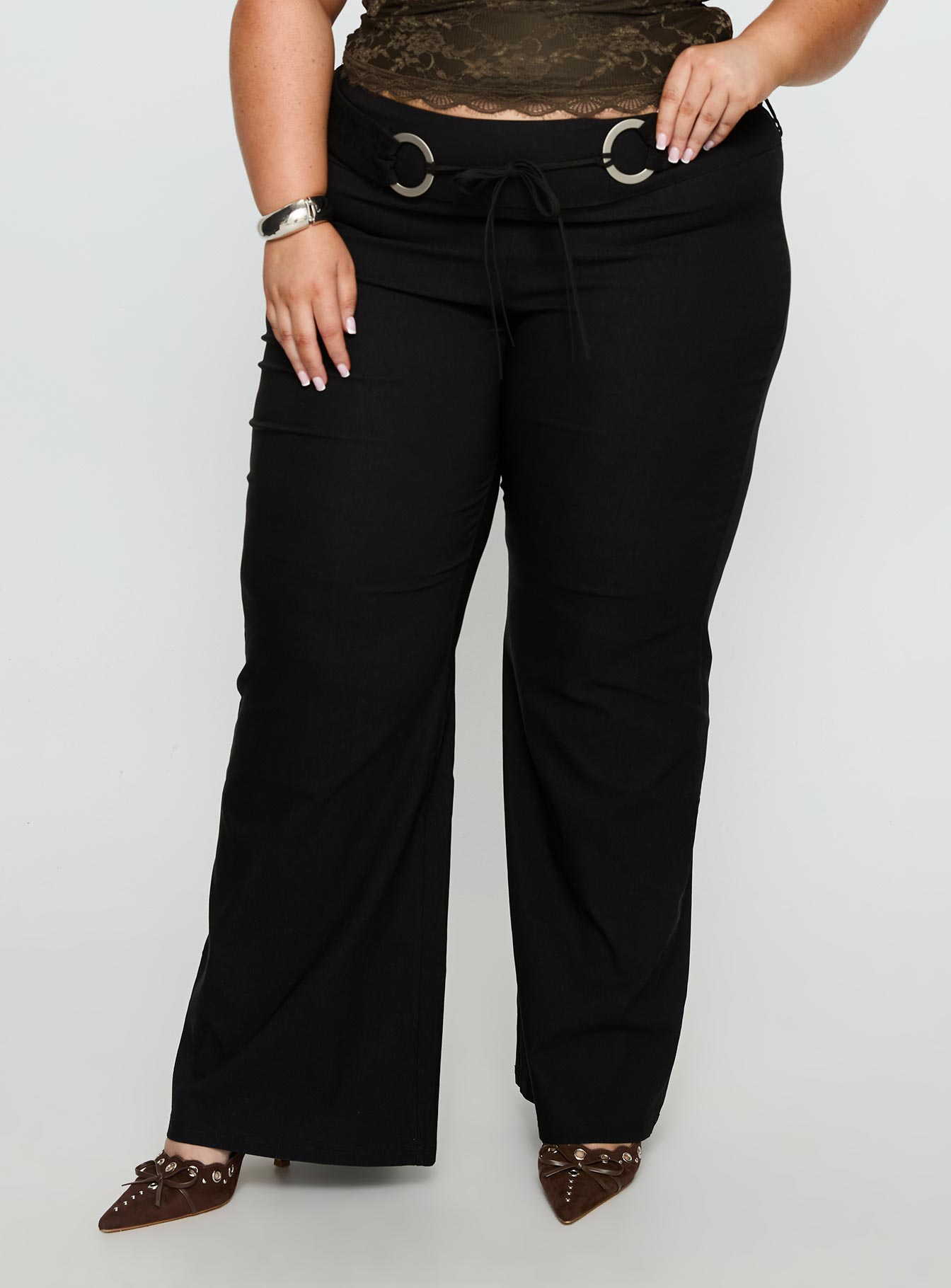 back view of model wearing Princess Polly Twinflame Low Rise Hardware Pants Black Curve Mid Rise Pants 