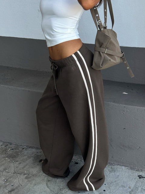 Showcasing Kennah Wide Leg Sweat Pants Iron Grey womens regular pants with mid-rise waist side view of model wearing Princess Polly