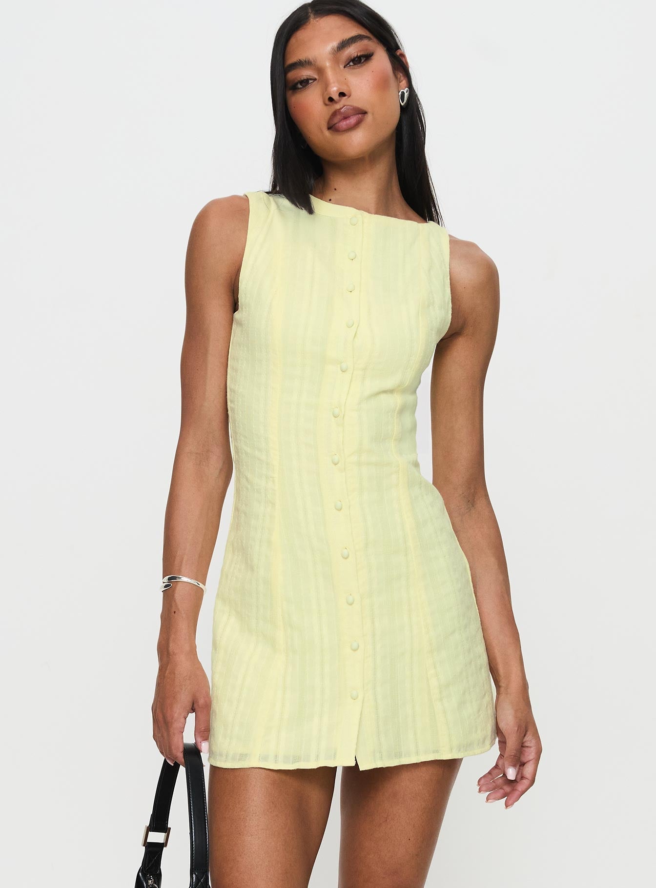 side view of model wearing Princess Polly Mimsie Embroidered Mini Dress Lemon Boat Neck 