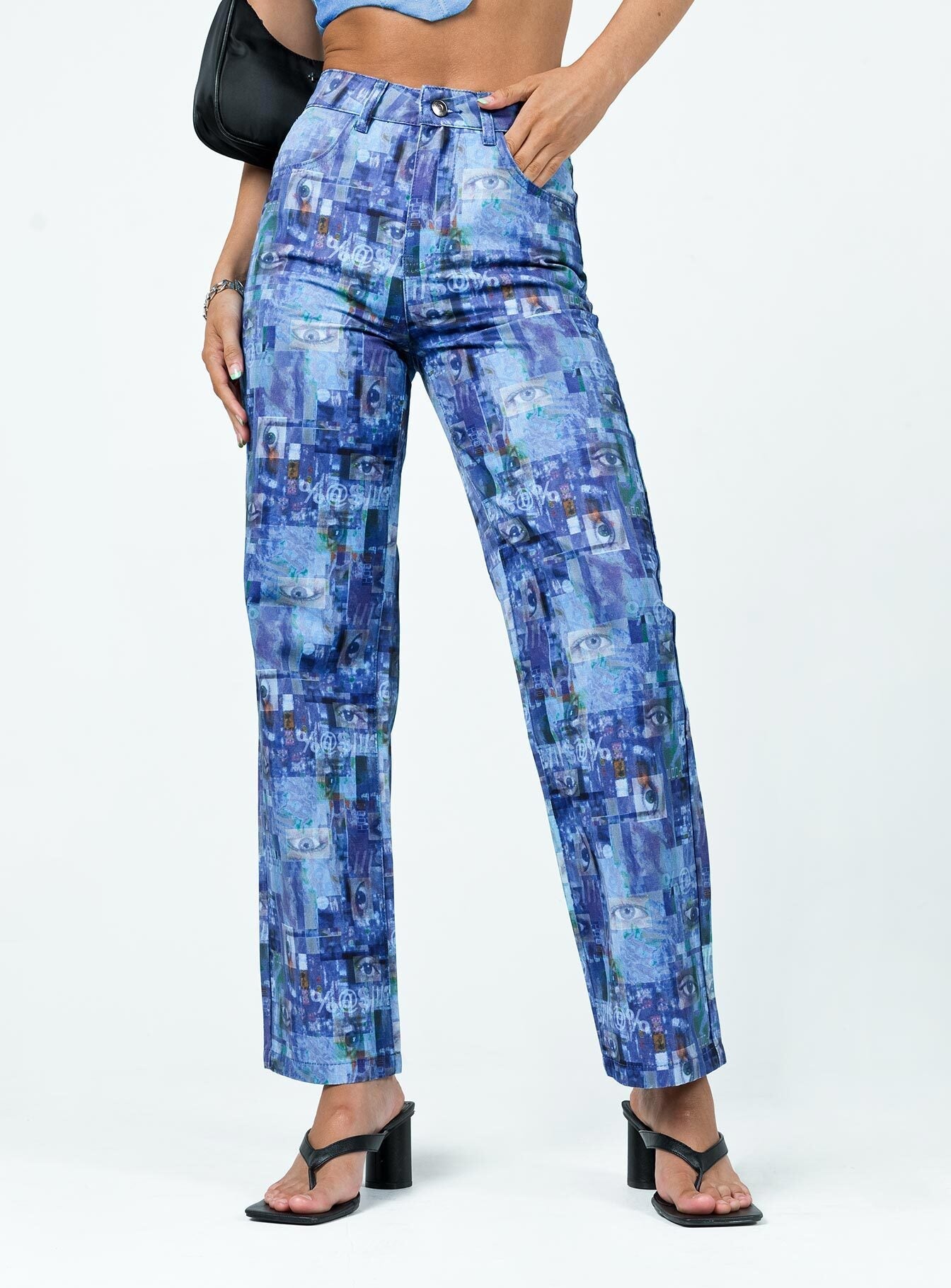 side view of model wearing Princess Polly The Ragged Priest Info Flares Drill Blue 