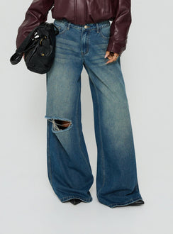 Featuring the Ramos Low Rise Wide Leg Distressed Jeans Dark Indigo womens-jeans with ripped details Princess Polly