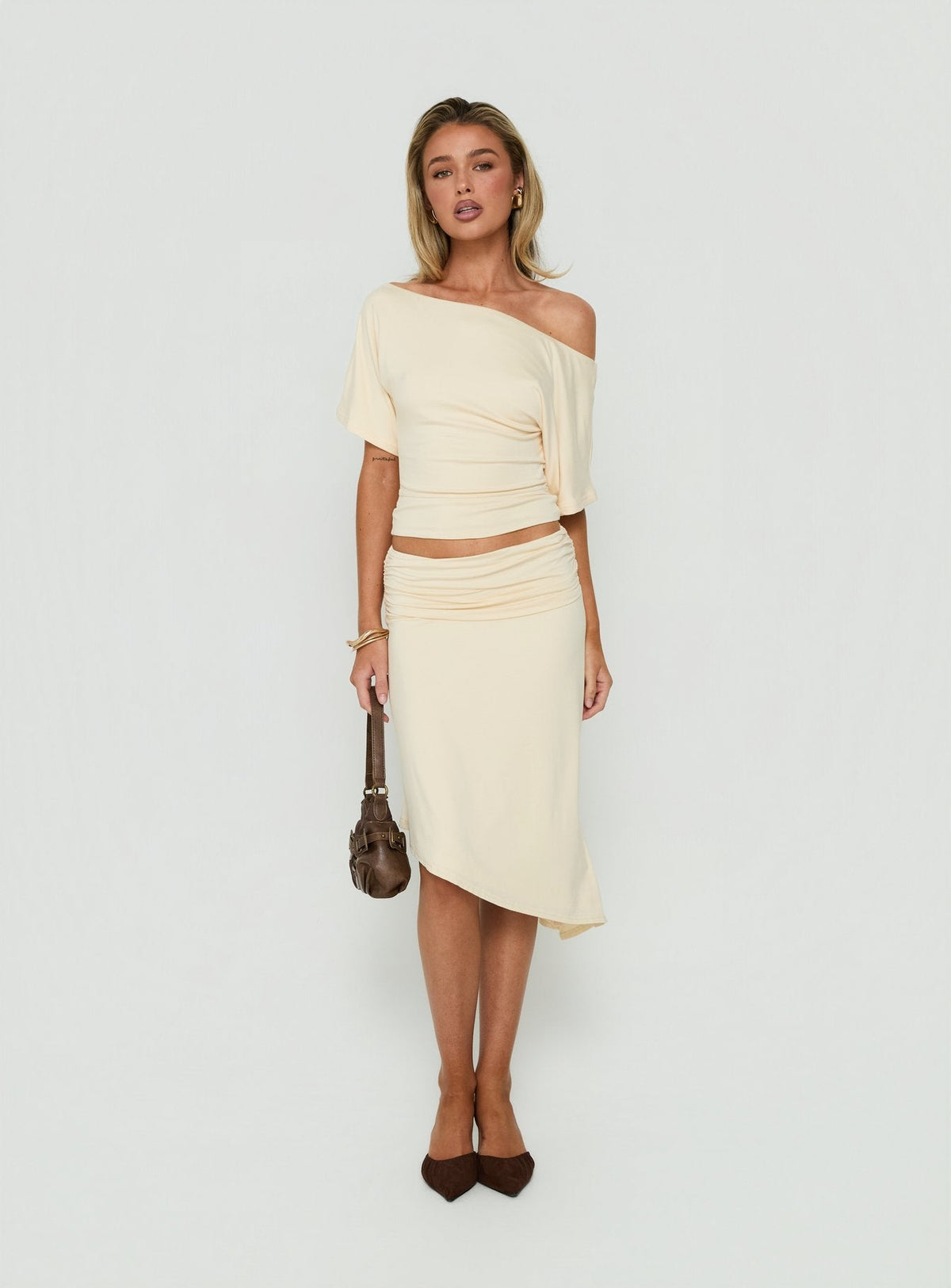 Featuring the Sezzia Ruched Asymmetrical Midi Skirt Beige womens-skirts with fitted silhouette and length detail Princess Polly