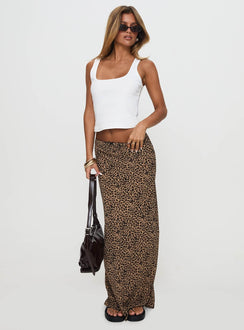   side view of model wearing Princess Polly Saffrone Maxi Skirt Leopard Maxi 