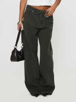 back view of model wearing Princess Polly Bruiser Tie Waist Mid Rise Wide Leg Jeans Green Petite High Rise Jeans 