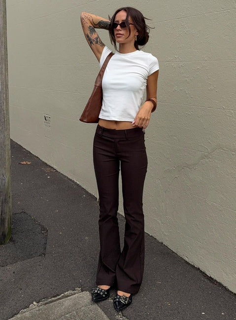 front view of model wearing Princess Polly Kinkirk Flared Pants Chocolate Petite Low Rise Pants 