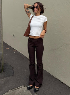 front view of model wearing Princess Polly Kinkirk Flared Pants Chocolate Tall Low Rise Pants 