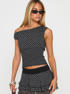 front view of model wearing Princess Polly Ready To Party Off Shoulder Top Black Polka Sleeveless Asymmetric Neckline 