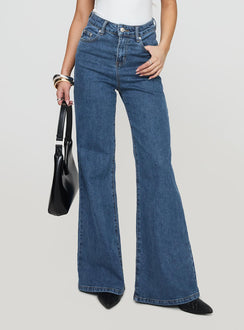front view of model wearing Princess Polly Lucille High Rise Flare Leg Jeans Mid Wash High Waisted 